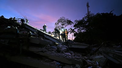 The search for bodies at the site of a collapsed building in Caraballeda in La Guaira. AFP