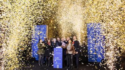 Confetti is released as the guests push the button to switch on the famous Paris lights. AP