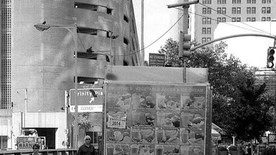 A Muslim prays next to his vending cart in lower Manhattan.