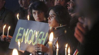 Pakistani civil society members in Islamabad take part in a candle-light vigil for the victims of a school attack. Anjum Naveed / AP Photo
