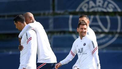 Lionel Messi (R) takes part in a training session at the Camp des Loges. AFP
