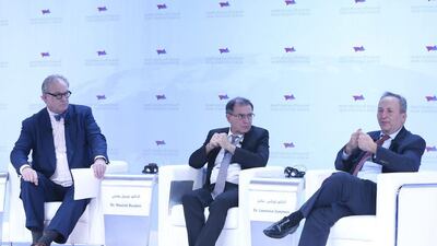 Larry Summers (right), former treasury secretary and director of the National Economic Council, speaks at the Arab Strategy Forum in Dubai as Nouriel Roubini, economist, (centre) looks on with Tom Keene of Bloomberg Business, left.. Ihsan Naji / Al Ittihad