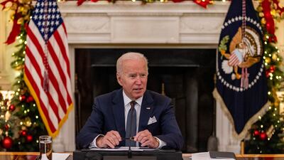 President Joe Biden delivers remarks in the state dinning room at the White House in Washington. The US president and the vice president held a meeting with members of the White House Covid-19 Response Team on the latest developments related to the Omicron variant. EPA