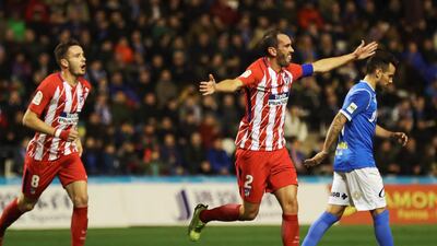 Atletico Madrid, in red and white stripes, were far too strong for Lleida, in blue, in the first leg, rendering the return leg in the capital all but academical. Alejandro Garcia / EPA