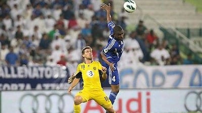 In one of the few times an Al Nasr player beat him to the ball, Helal Seed, right, goes over the top of Al Wasl's target man,Emiliano Alfaro. The Italian had the last laugh, scoring twice in the 2-2 draw.
