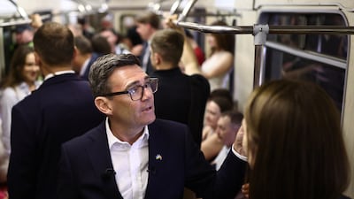 KYIV, UKRAINE - AUGUST 24: Britain's Prime Minister Andy Burnham (L) reacts as he stands in a metro carriage among passengers during the journey between the metro stations Zoloti Vorota and Lukanivska on August 24, 2026 in Kyiv, Ukraine. Ukraine is marking the 35th anniversary of its independence on August 24, with Andy Burnham scheduled to meet President Zelensky and co-chair a Coalition of the Willing meeting with Germany's Chancellor Friedrich Merz and France's president Emmanuel Macron joining by video link. (Photo by Henry Nicholls - WPA Pool / Getty Images)