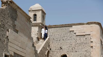 French President Emmanuel Macron tours the Our Lady of the Hour Church in Iraq's second city of Mosul. AFP