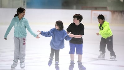 Children ice-skating at Zayed Sports City. Silvia Razgova / The National