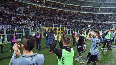 Alessandria players cheer their supporters after the 1-0 Coppa Italia semi-final first leg loss on Tuesday night to AC Milan in Turin. Andrea Di Marco / EPA