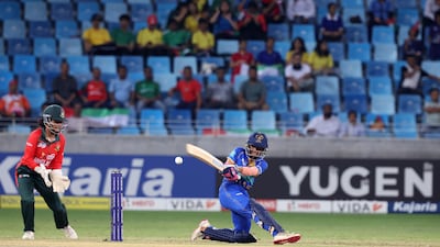 UAE's Theertha Satish in action against Bangladesh at Dubai International Stadium.