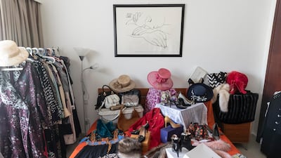 Ms Jeker models the clothes, and takes photos of them to sell online