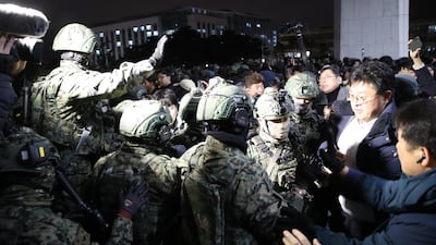 South Korean soldiers try to get into the National Assembly on December 4 in Seoul. Getty Images