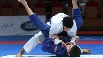 Asslan Nakhwa (bottom) and Mohammed Mohammed compete at the Abu Dhabi Kids World Championship junior boys event on Saturday, April 16, 2016, at the IPIC Arena at Zayed Sports City in Abu Dhabi. Delores Johnson / The National