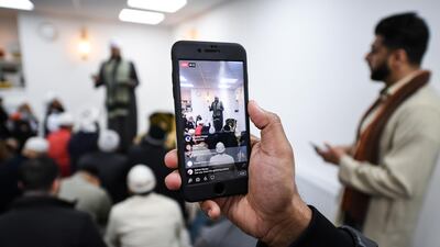 Members of the Muslim community listen to Iman Mufti Abdur-Rahman Mangera as they attend the opening of the first mosque built on the Western Isles, Stornoway, Scotland, on May 11, 2018. Jeff J Mitchell / Getty Images