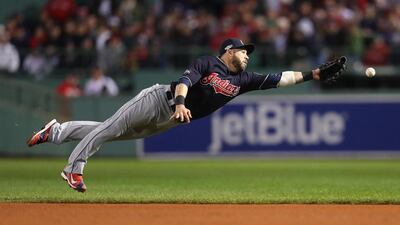 Jason Kipnis of the Cleveland Indians dives for a single hit by Travis Shaw of the Boston Red Sox in the eighth inning during Game 3 of the American League Division Series at Fenway Park on October 10 in Boston, Massachusetts. Maddie Meyer / Getty Images / AFP