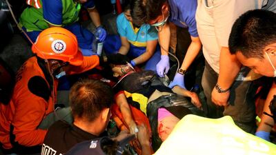 Emergency responders continue search operations at a damaged commercial building following an earthquake in Porac town, Pampanga Province, north of Manila. EPA