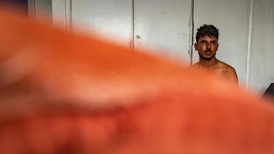 A man awaits further treatment at a hospital in Hasakeh after a fire broke out as Syrians celebrated a wedding at Al Hol displacement camp in north-eastern Syria. AFP