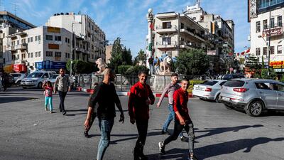 Palestinian youth in the centre of the West Bank city of Ramallah, after the Palestinian Authority announced an end to its two-month coronavirus lockdown. Unemployment among Palestinian youth is 38% far beyond the regional average in the Middle East and North Africa according to the World Bank. AFP