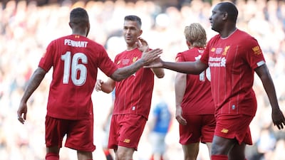 Luis Garcia celebrates his goal for Liverpool legends at the Ibrox Stadium. Press Association