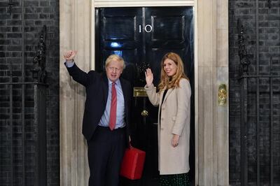 Prime Minister Boris Johnson, pictured entering Downing Street with partner Carrie Symonds, now has a strong mandate to deliver Brexit after an emphatic election victory for the Conservative Party. Getty