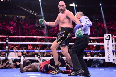 Deontay Wilder is knocked down by Tyson Fury in the 11th round for the third time in the fight. Reuters