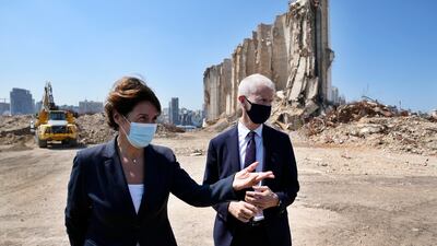 French Foreign Trade Minister Franck Riester, right and the French Ambassador to Lebanon Anne Grillo, visit Beirut's port, devastated in a massive deadly explosion in August last year. AP