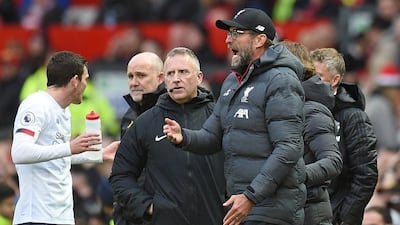 Liverpool manager Jurgen Klopp reacts to Sadio Mane's disallowed goal as fourth official Jonathan Moss looks on. AFP