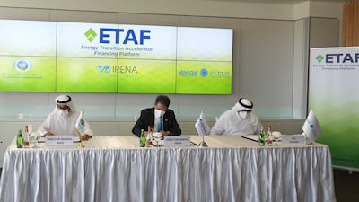 From left, Mohammed Al Suwaidi, director general of the Abu Dhabi Fund for Development; Mohamed Al Ramahi, Masdar’s chief executive; and Francesco La Camera, director general of Irena, signed the agreements on Thursday. Photo: Irena