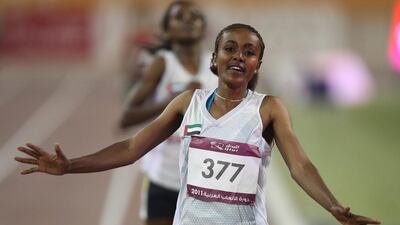 The United Arab Emirates' Alia Saeed arrives first to win gold in the women's 5,000 metres final at the 2011 Arab Games in Doha on December 19, 2011. Karim Jaafar / AFP