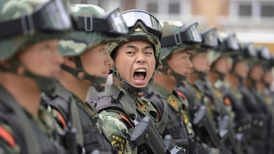 A paramilitary policeman shouts a command during a training session at a base in Taiyuan, Shanxi province. Jon Woo / Reuters