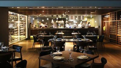 Marina Social at the Intercontinental Dubai Marina has a modern New York vibe with sleek, dark-wood interiors. Sarah Dea / The National