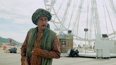 Director Miguel Gomes, below, has split Arabian Nights into three films. Above, the director in a scene from the third film The Enchanted One. AFP; courtesy Arabian Nights