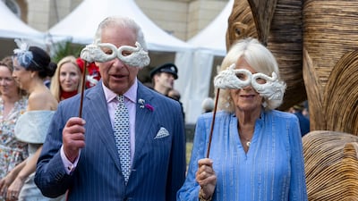 LONDON, ENGLAND - JUNE 28: King Charles III and Queen Camilla pose with masquerade masks as they attend the Animal Ball at Lancaster House to mark the 20th anniversary of wildlife conservation charity Elephant Family on June 28, 2023 in London, England. (Photo by Heathcliff O'Malley - WPA Pool / Getty Images)