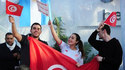 Tunisia soccer fans gather to watch their national team play against France in a World Cup Group D soccer match played in Qatar, on a large screen set up for fans in Tunis, Tunisia. AP Photo