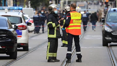French policemen and firefighters stand guard. AFP