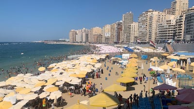 Crowds flock to the beach at Egypt's Mediterranean city of Alexandria. Hamza Hendawi / The National