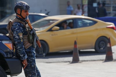 An Iraqi security officer on a street in central Baghdad after a two-day curfew was imposed to enable the count. AFP