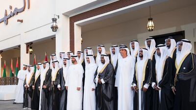 Sheikh Mohamed bin Zayed, Ahmed Al Zaabi, and Jaber Al Suwaidi stand for a photograph during a mass wedding held at Majlis Al Manhal. Hamad Al Kaabi / Ministry of Presidential Affairs