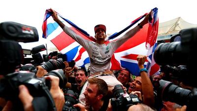 Lewis Hamilton celebrates his Formula One world title on Sunday after winning in the US Grand Prix at the Circuit of the Americas. Clive Mason / Getty Images / AFP