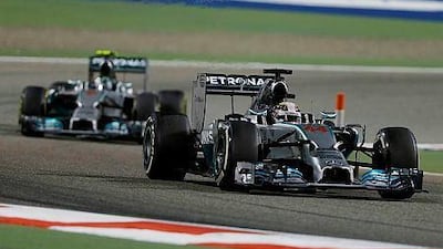 Mercedes driver Lewis Hamilton, front, of Britain and teammate Mercedes driver Nico Rosberg of Germany will meet again in the Japan Grand Prix this weekend. (AP Photo/Kamran Jebreili)