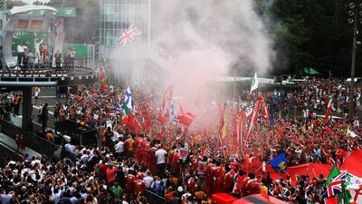 Nico Rosberg of Mercedes, Lewis Hamilton of Mercedes and Sebastian Vettel of Ferrari celebrate on the podium following the Formula One Italian Grand Prix. Mark Thompson / Getty Images
