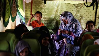 A family sits in a bus heading to Egypt. Reuters