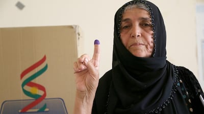 A Kurdish woman in traditional clothes shows her ink-marked finger after casting her vote in the Kurdistan parliamentary election at a polling station in Erbil, the capital of the Kurdistan Region in Iraq. With over three million people eligible to vote, the semi-autonomous region is voting on its parliamentary elections a year after a failed bid for independence from Iraq. EPA