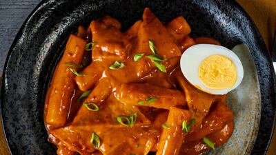 Traditional tteokbokki rice cakes are elevated by a creamy sauce
