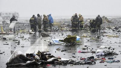Russian Emergency Ministry employees investigate the wreckage of the crashed plane at the Rostov-on-Don airport. AP Photo