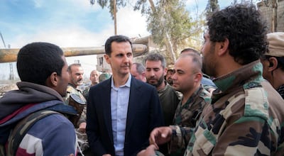 Syrian president Bashar Al Assad meets troops in Ghouta in 2018. Sana / Reuters