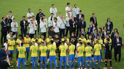 Brazil players applaud the Peru team. Reuters
