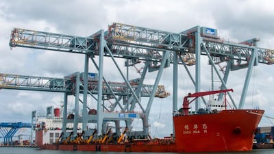 Cargo vessel Zhen Hua 15 was saluted by tug boats as it became the first ship to be berthed at the under-construction Vizhinjam International Seaport in Kerala. Photo: Vizhinjam Port