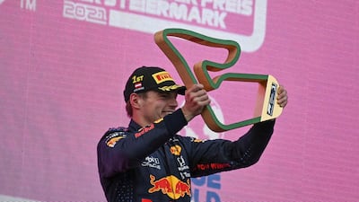 Dutch driver driver Max Verstappen on the podium after winning the race. EPA