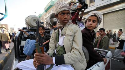 Armed boys on the back of a pick-up truck at a Houthi rally in Sanaa in March, 2015. The Houthis rebel group have been accused of increasing the recruitment of child soldiers since they launched their military campaign by taking over the capital in September 2014. REUTERS/Mohamed Al Sayaghi